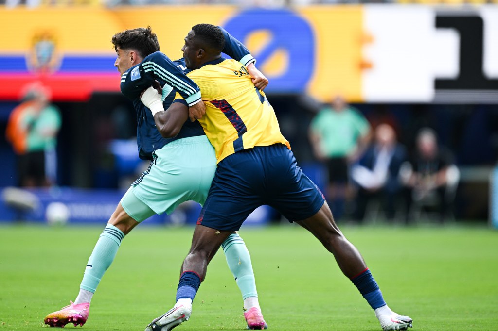 Willian Pacho holds off Kai Havertz during Ecuador v Germany at the 2026 World Cup